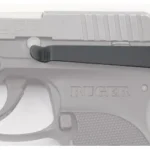 Techna Clip Ruger LCP LH black clip mounted on left side of grey pistol, close-up view