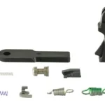APEX M2.0 FLAT FORWARD SET TRGR KIT black trigger and assorted springs and components, top view
