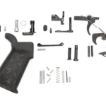 SPIKE'S LPK STANDARD 556 BLK, black grip, trigger and assorted small parts laid out