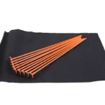 Gun Storage Solutions GSS RIFLE ROD orange rods fanned across a black fabric panel, top view