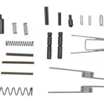 TPS AR-15 Quick Repair Kit, assorted black and silver springs, pins and small parts laid out