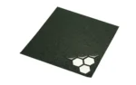 Hexmag Grip Tape black textured sheet with honeycomb cutouts at one corner