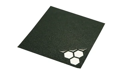Hexmag Grip Tape black textured sheet with honeycomb cutouts at one corner