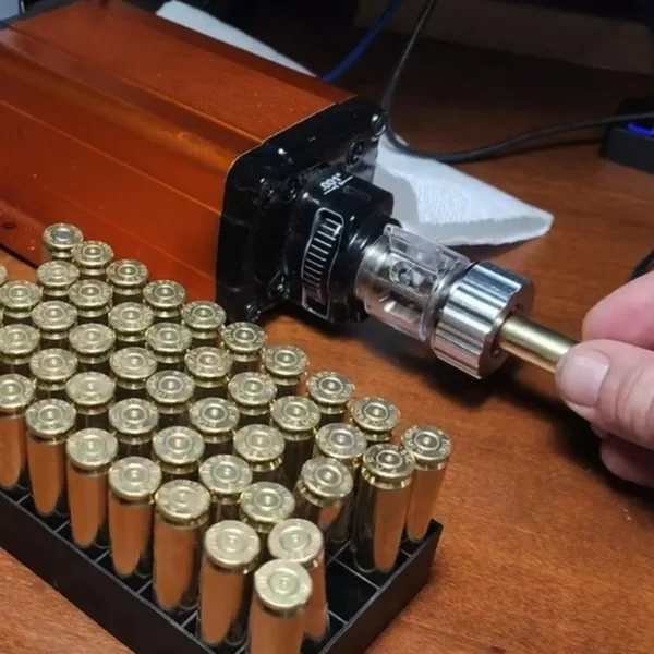 Lyman Brass-Smith Case Trim Xpress, black trimmer in use beside rows of brass cases