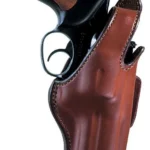 Bianchi Model 5BHL Thumbsnap, tan leather right-hand holster holding a handgun