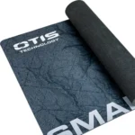 Otis Sportsmans Cleaning Mat, dark patterned mat partially rolled at one corner