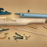 Traditions Black Powder Kentucky Pistol Build-It-Yourself Kit with raw wood stock and loose parts