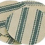 CVA Shooting Patches, stacked round beige cloth patches with green striped pattern, top view