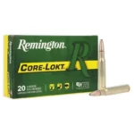 Remington Rifle Ammunition, green and yellow Core-Lokt box with two brass cartridges