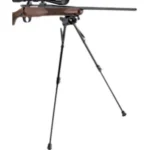 Champion BIPOD W/CANT & TRAVERSE black bipod with extended legs supporting a rifle