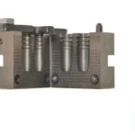 RCBS Flat Nose Rifle Bullet Mould, open grey metal mould with a cast bullet beside it