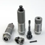 RCBS AmmoMaster .50 BMG Die Kit, silver and black dies and components arranged upright and flat