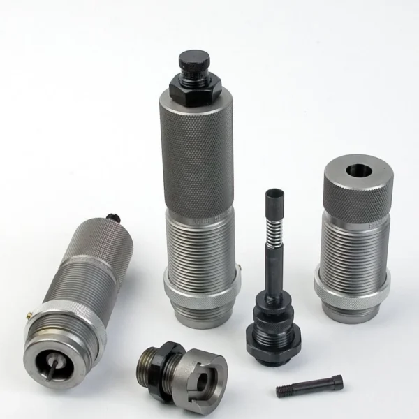 RCBS AmmoMaster .50 BMG Die Kit, silver and black dies and components arranged upright and flat