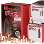 Hornady FTX Rifle Bullets, copper-colored pointed bullets displayed with red product boxes