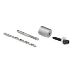 Hornady Stuck Case Remover, drill bit, tap, spacer and screw arranged on white
