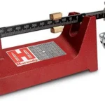 Hornady Balance Beam Scale, red angled front view with black beam and metal pan