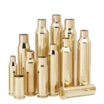 Hornady Unprimed Brass Rifle Cartridge Cases upright and grouped, with one case lying in front