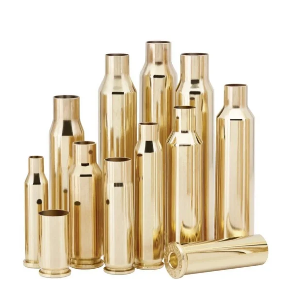 Hornady Unprimed Brass Rifle Cartridge Cases upright and grouped, with one case lying in front