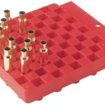 Hornady Universal Reloading Block, red block in top angled view with several cartridge cases