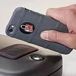 Hornady RAPiD Safe RFID Sticker on a black safe with a handheld RFID reader above