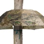 GSM Pop-Up Umbrella, open camouflage umbrella wrapped around a tree trunk, front view