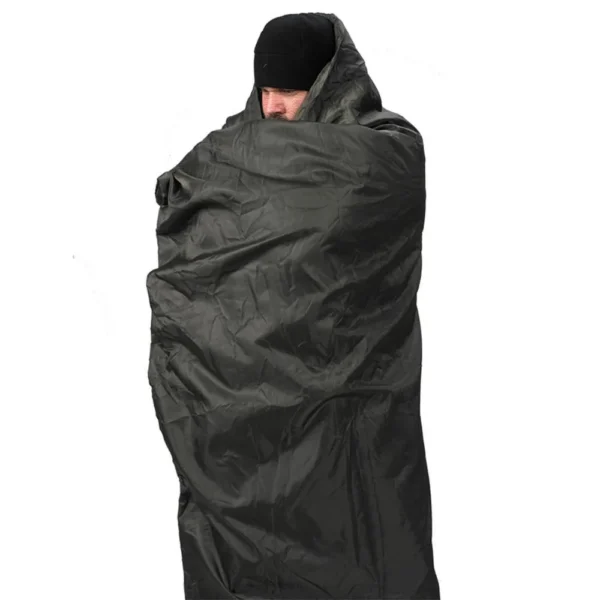 Snugpak Jungle Blanket WGTE, olive blanket wrapped around a standing person