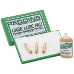 Redding Case Lube Kit with green pad case, white lubricating pad, bottle and three brass cases