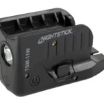NIGHTSTICK WML FOR G43X black side view with round light lens, switch, and mounting rail