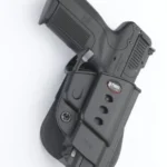 Fobus Evolution Series paddle holster for FN 5.7, black, right side view holding a pistol