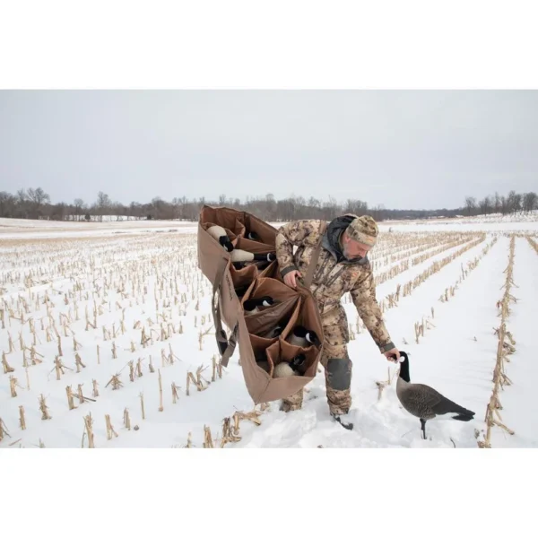 Higdon Outdoors X Slot Universal Goose Decoy Bag, brown bag carried in snowy field