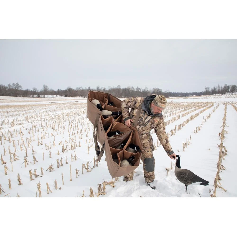 primary-38000 Higdon Outdoors X Slot Universal Goose Decoy Bag, brown bag carried in snowy field