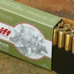 Swift Scirocco II Rifle Ammunition, green box beside upright brass cartridges in a black tray
