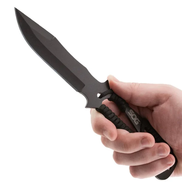 SOG Throwing Knives, black knife held in hand with pointed blade and cord-wrapped handle