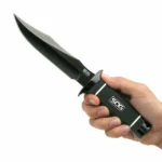 SOG Tech Bowie Knife black angled view with clip-point blade, guard and textured handle