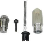 Lee APP Swage Kit with silver dies, spring and black components arranged on white