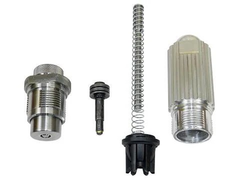 Lee APP Swage Kit with silver dies, spring and black components arranged on white