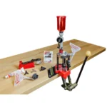 Lee Classic Turret Press Kit, red press mounted on a wood bench with tools and accessories