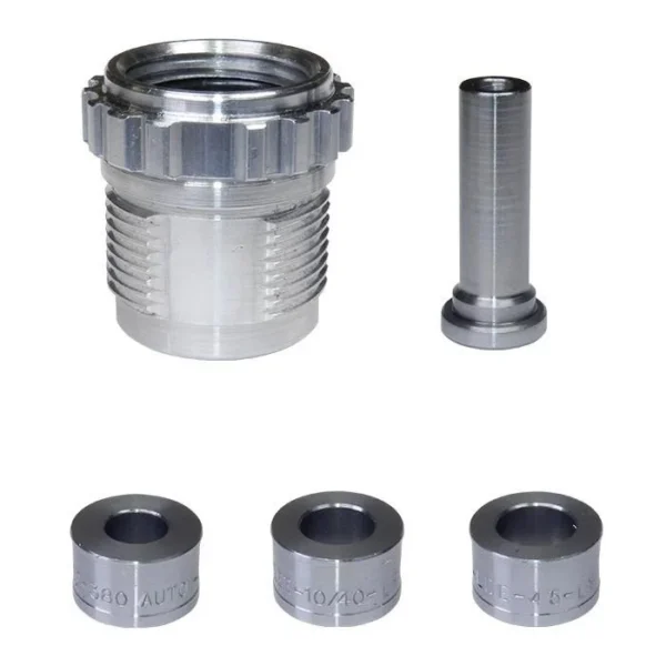 Lee App Bulge Buster Kit, silver metal die and four cylindrical components arranged on white