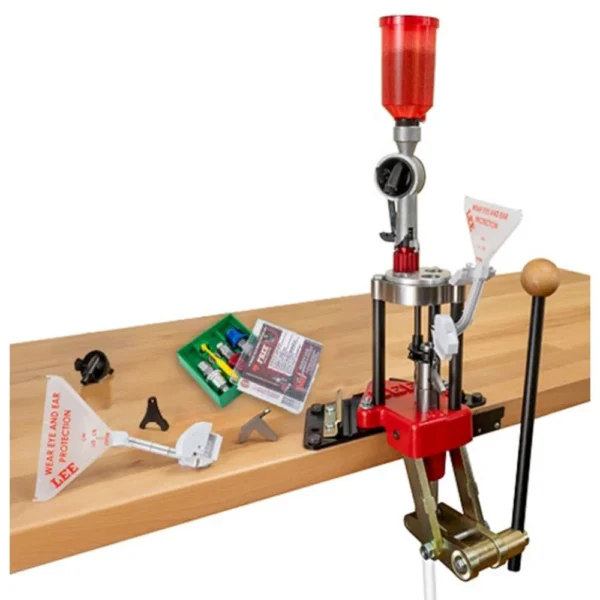 Lee Classic Turret Press 9mm Luger 3 Die, red press mounted to a wooden bench with accessories