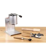 LEE Ready To Cast Kit, silver casting pot and hand tools arranged on a wooden bench