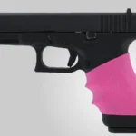 Hogue Grips HandAll Full Size Universal Grip Sleeve, pink finger-groove sleeve fitted on black handgun