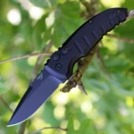 Hogue A01-Microswitch automatic folder knife, open with black handle and drop-point blade