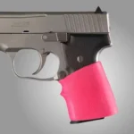 Hogue Grips HandAll Jr. pink grip sleeve, right-side view fitted to a handgun grip