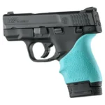 Hogue HandAll Beavertail aqua grip sleeve fitted to a black pistol, left-side view