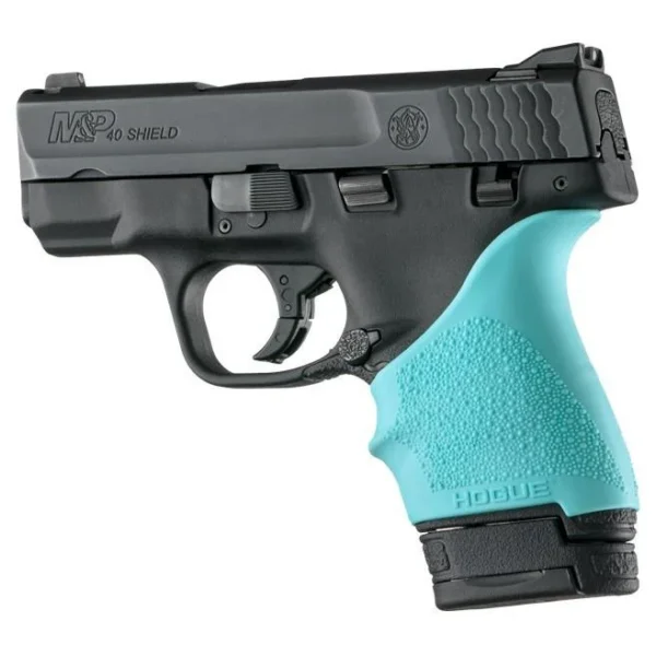 Hogue HandAll Beavertail aqua grip sleeve fitted to a black pistol, left-side view