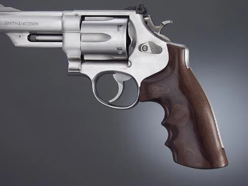 Hogue S&W N Square Butt Grip, brown finger-groove grip mounted on a silver revolver, right-side view