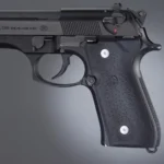 Hogue Beretta Grips 92/96 Series black rubber grip panels installed on pistol, left-side view