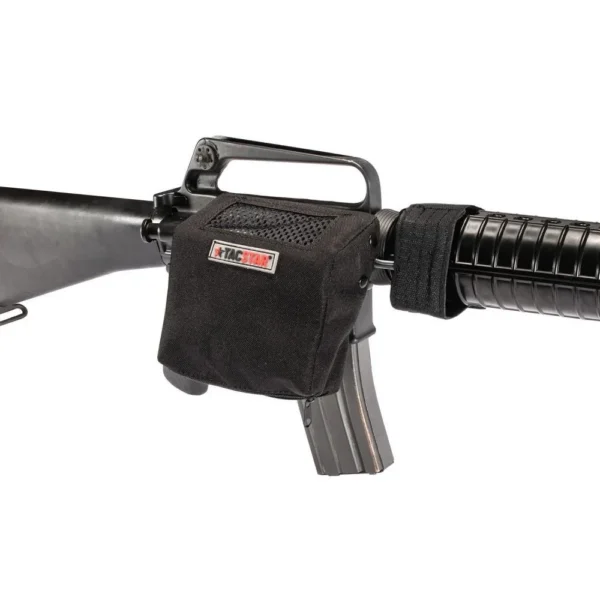 Tacstar Universal Brass Catcher black shell catcher mounted beside a rifle receiver