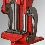Forster Curved Linkage for Co-Ax Press, front view of dark curved linkage installed on red press
