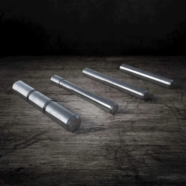 Rival Arms Frame Pin Set for Glock GEN3, three stainless steel pins on a dark surface